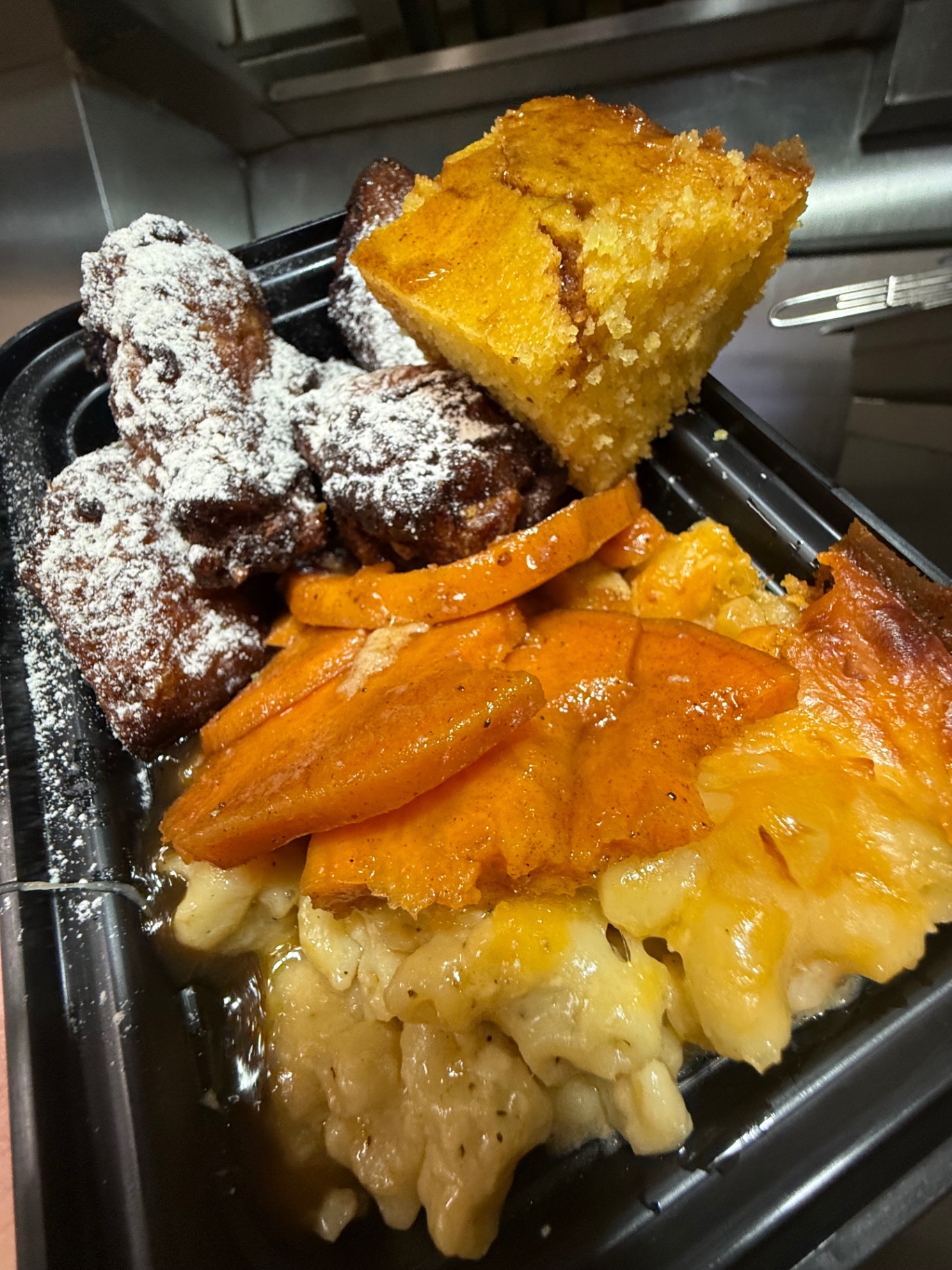 Fried wings with candied yams, mac and cheese and cornbread